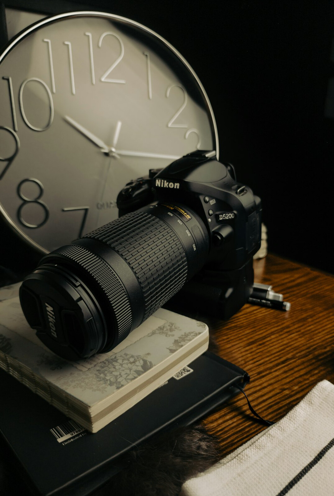 Editorial desk with laptop, notebook, and camera used by a journalist