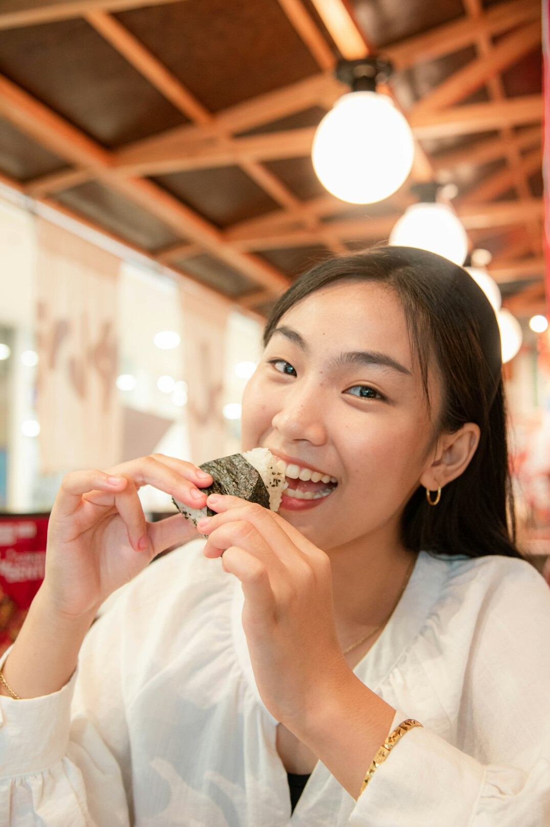 Portrait of a Japanese female editor in chief smiling in a blazer