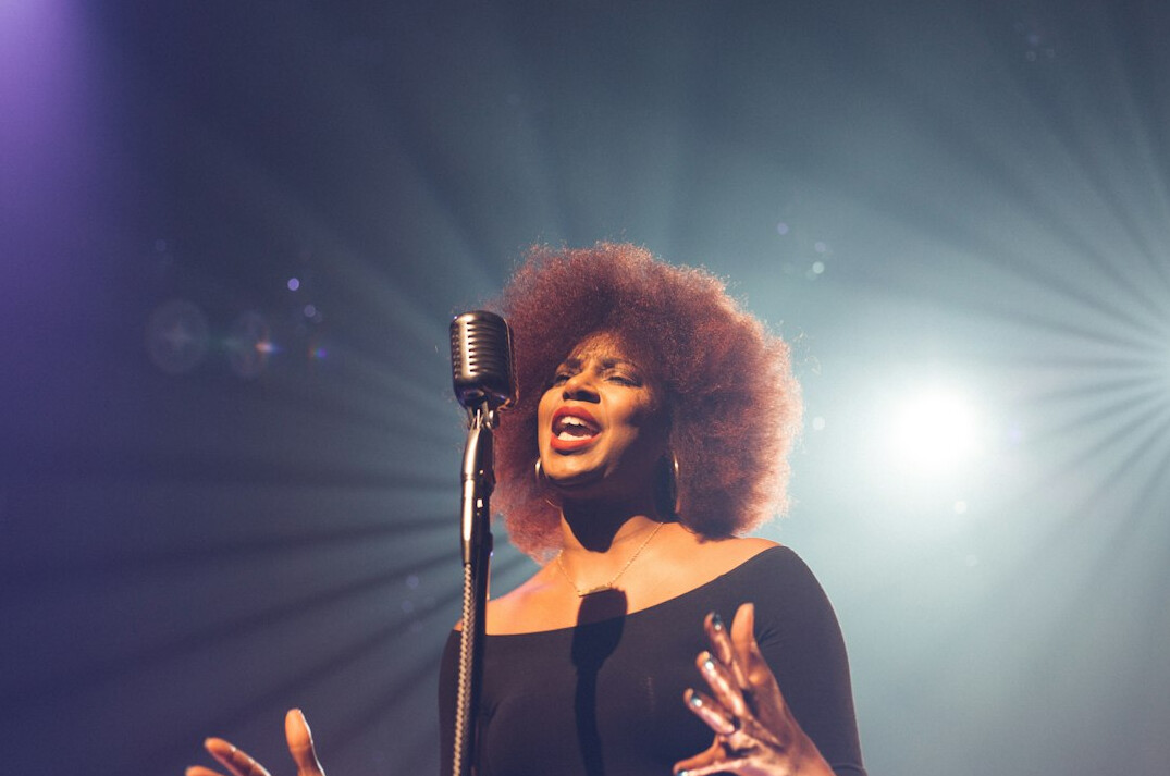 singer on stage with lights